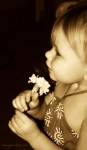 Sasha smelling flower